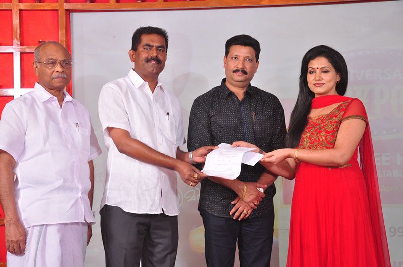 Mumbai-based businessman Abraham Mathew and wife, cine artist Sheela Abraham, handing over the documents of the first booking in the Anniversary Jackpot offer.