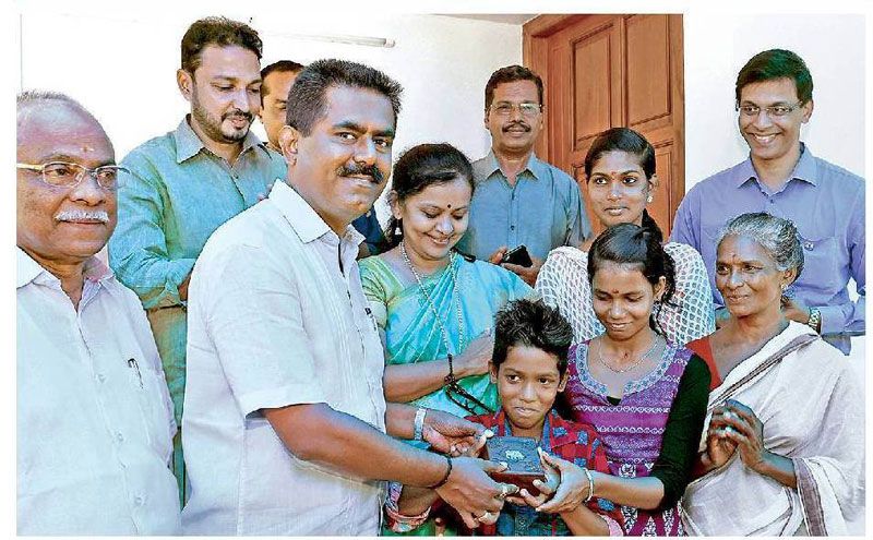 Mr. Sunil Kumar, MD of Asset Homes is handing over the key of the house constructed by Asset Homes to the three ill-fated children.