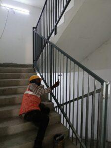 MAIN STAIR HANDRAIL PRIMER WORKS